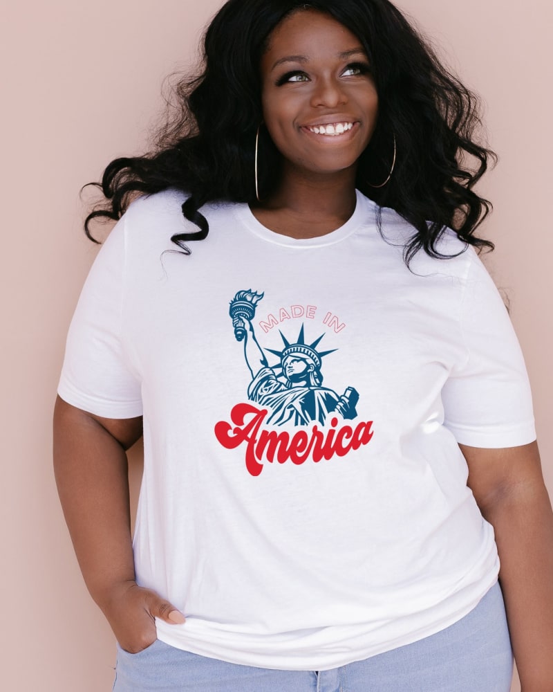 Front of a model wearing a size 2XL Made In America Liberty in White by Simply Sage Market. | dia_product_style_image_id:281536